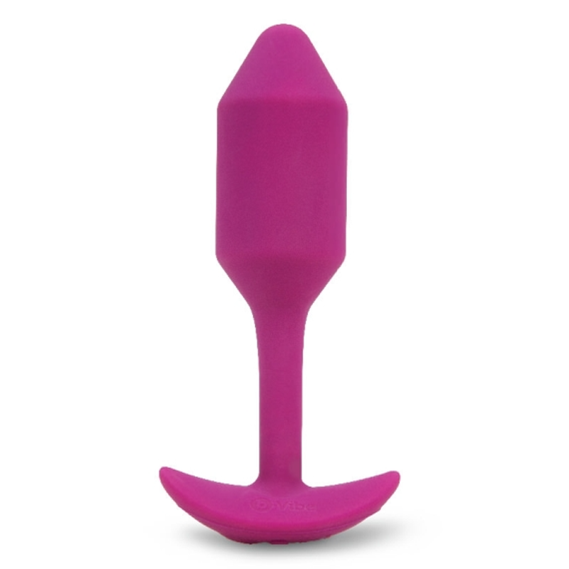 Rose pink vibrating snug plug with a tapered tip and weighted core for deep stimulation.
