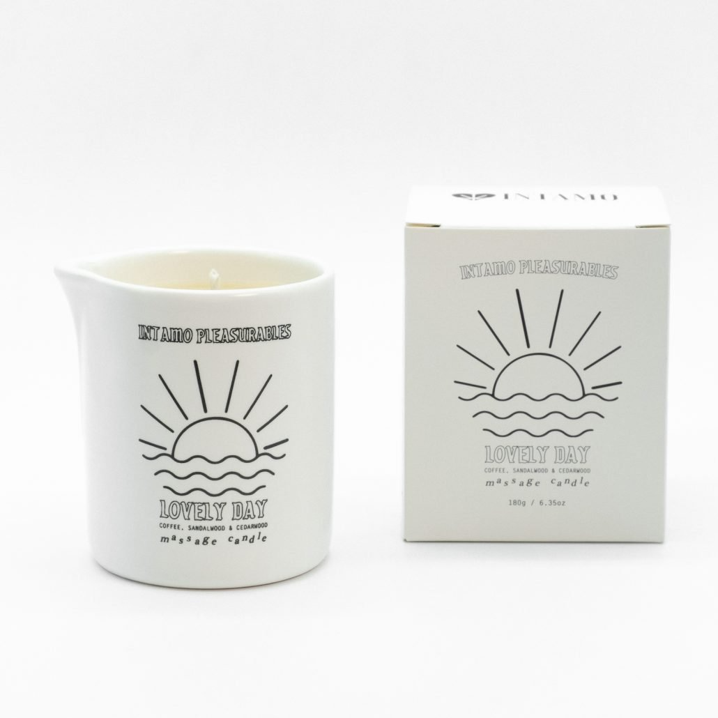 Brown Intamo Lovely Day Massage Candle with Coffee, Sandalwood, and Cedar fragrance.